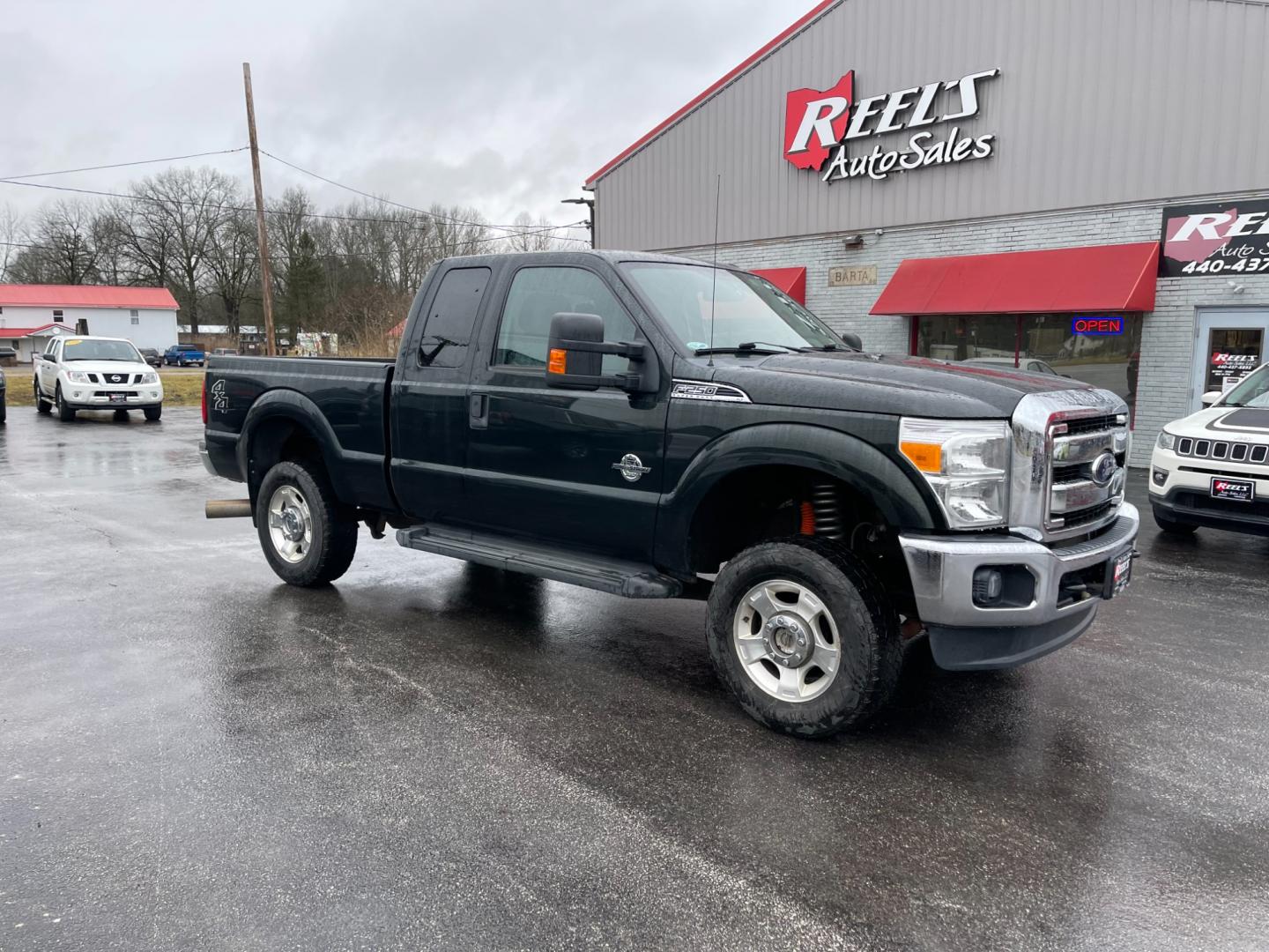 2015 Green /Gray Ford F-250 SD XLT SuperCab Long Bed 4WD (1FT7X2BT6FE) with an 6.7L V8 OHV 16V DIESEL engine, 6-Speed Automatic transmission, located at 547 E. Main St., Orwell, OH, 44076, (440) 437-5893, 41.535435, -80.847855 - Photo#3